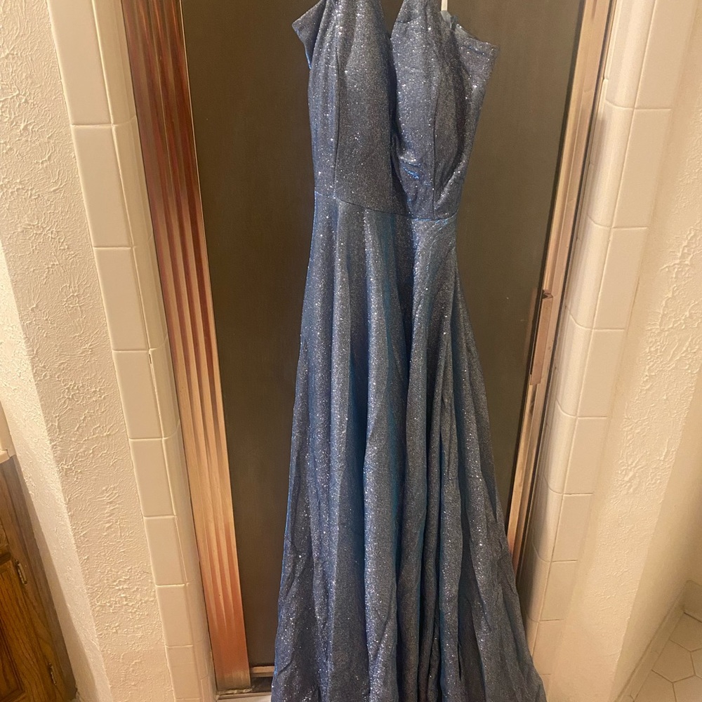 Beautiful, shimmery floor length gown. Worn one time. very full, strapleas back.